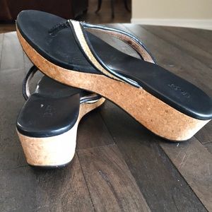 Ugg cork and black leather sandals.
